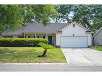 Charming single-story home with well-manicured lawn and attached two-car garage at 109 New Spring Ct, Summerville, SC 29485