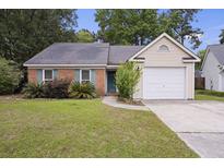 Charming single-story home featuring a brick facade, blue shutters, and a well-maintained front yard at 111 Macfarren Ln, Summerville, SC 29485