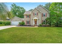 Charming two-story home with red shutters and lush green lawn, perfect for Gathering living at 113 Essex Dr, Summerville, SC 29485