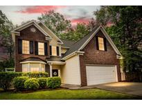 Beautiful two-story brick home featuring a two-car garage and landscaped front yard at 5404 Red Fork Ln, North Charleston, SC 29420