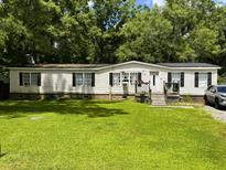 Traditional single-Gathering home with a lush front lawn and a classic front-facing elevation at 104 Dean Dr, Summerville, SC 29483