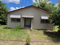 Modest single story home with vinyl siding and awning-covered windows at 112 Carver St, Walterboro, SC 29488