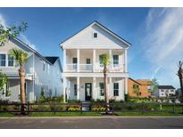 Charming two-story white home featuring double porches, black accents, and manicured landscaping at 1423 Clay Field Trl, Summerville, SC 29485
