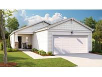 Charming one-story home featuring white siding, an attached garage, and a welcoming front porch at 308 Tiliwa Street, Summerville, SC 29486