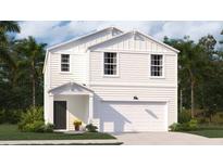 Charming two-story home featuring a covered porch, a two car garage, and crisp, white siding at 606 Quiet Valley Road, Summerville, SC 29486