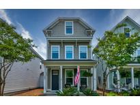 Charming two-story home with a welcoming front porch and well-maintained landscaping at 1061 Ashley Gardens Blvd, Charleston, SC 29414