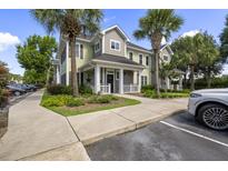 Charming townhome with mature palms and a welcoming front porch, perfect for relaxing outdoors at 1225 Blakeway St # 407, Charleston, SC 29492
