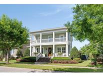 Charming two-story home featuring double porches, manicured landscaping, and a welcoming entrance at 1527 Wando View St, Charleston, SC 29492