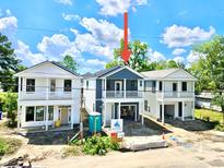 New construction home showing the exterior elevation, with porches on the second story and undercarriage parking at 2033 Echo Ave, North Charleston, SC 29405