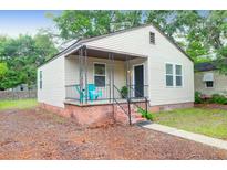 Charming single-story home featuring a cozy porch, a well-maintained yard, and traditional siding at 2350 Kent Ave, North Charleston, SC 29405