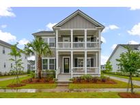 Charming two-story home featuring a double porch, well-maintained landscaping, and inviting curb appeal at 4129 Maidstone Dr, Mount Pleasant, SC 29466