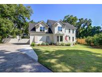 Charming two-story home featuring a well-manicured lawn and traditional architecture at 1081 Groves Manor Ct, Mount Pleasant, SC 29464