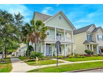 Charming two-story home with a spacious porch and landscaped front yard at 122 Foxglove Ave, Summerville, SC 29483