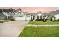 Charming one-story home featuring a two-car garage and well-manicured lawn at 331 Fish Creek Ct, Summerville, SC 29486