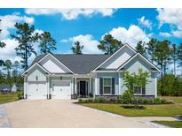 Charming single-Gathering home featuring a two-car garage and beautifully landscaped front yard at 393 Tupelo Lake Dr, Summerville, SC 29486
