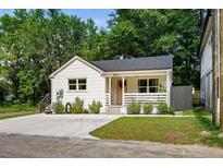 Charming home featuring a well-manicured lawn and inviting front porch, showcasing classic curb appeal at 5814 Knight St, Hanahan, SC 29410