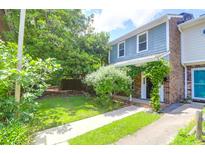 Charming two-story townhome with inviting front yard and walkway at 680 Buckhall Ct, Mount Pleasant, SC 29464