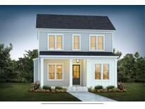 Charming two-story home with inviting front porch, well-manicured lawn, and beautiful landscaping at 723 Rambling Leaf Ln, Summerville, SC 29486