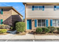 Charming townhouse exterior with a blue door and matching blue shutters at 111 Elmwood Ave # A, Ladson, SC 29456
