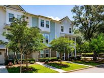 Inviting townhouse with well-manicured lawn and lush landscaping for an inviting curb appeal at 114 Rowans Creek Dr, Charleston, SC 29492
