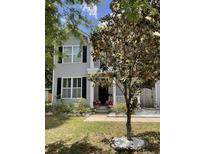 Charming two-story home with gray siding, black shutters, and a well-manicured lawn at 1199 Landau Ln, Mount Pleasant, SC 29466