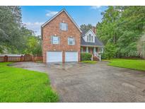 Charming brick home with two-car garage and manicured lawn at 125 Eston Dr, Goose Creek, SC 29445