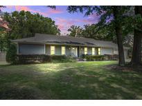 Charming home featuring a well-maintained lawn and inviting curb appeal at dusk at 19 Milano Ct, Hanahan, SC 29410