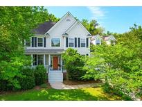 Charming two-story home featuring a welcoming front porch and well-maintained landscaping at 200 Oak Point Landing Dr, Mount Pleasant, SC 29464