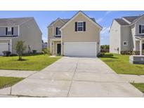 Inviting two-story home featuring a classic design, a two-car garage, and a well-manicured lawn at 278 Catawba Branch Way, Moncks Corner, SC 29461