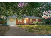 Charming brick and siding home with a well-maintained lawn and mature trees, creating a welcoming curb appeal at 113 Owens Cir, Summerville, SC 29483