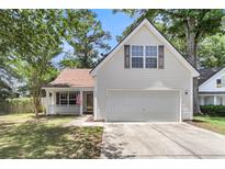 Charming home featuring a classic design, well-maintained lawn, and a two-car garage, perfect for a growing Gathering at 172 Ashton Dr, Goose Creek, SC 29445