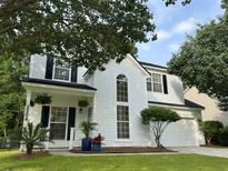 Charming two-story home featuring black shutters, a manicured lawn, and an attached two car garage at 2204 Andover Way, Mount Pleasant, SC 29466