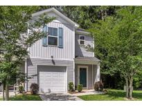 Charming home featuring a one-car garage and neatly maintained lawn at 271 Jackson St, Goose Creek, SC 29445