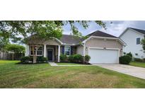 Charming single-story home with a well-manicured lawn and inviting curb appeal at 7019 Lanier St, Hanahan, SC 29410
