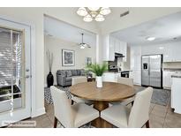 Inviting dining area adjacent to the kitchen features a round table, neutral chairs, and easy access to living spaces at 7869 High Maple Cir, North Charleston, SC 29418