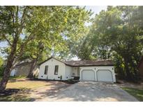 Charming single-story home with a well-manicured lawn, inviting curb appeal, and a two car garage at 10 Bayshore Blvd, Goose Creek, SC 29445