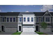 Charming townhome featuring a two-car garage, gray siding, and large windows that add natural light at 120 Brown Swiss Cir, Summerville, SC 29483