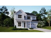Charming two-story home with light blue siding, white trim, and a covered front porch at 218 Yalton St, Summerville, SC 29486