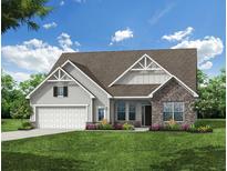 Inviting single-Gathering home featuring stone accents, a two-car garage, and manicured lawn at 260 Huguenot Trl, Huger, SC 29450