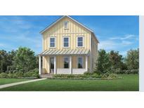 Charming two-story home with a covered porch and well-manicured lawn on a sunny day at 140 Falaise St, Charleston, SC 29492