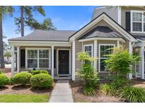 Charming townhome with a well-manicured front yard and inviting entrance at 4801 Shady Tree Ln, Summerville, SC 29485