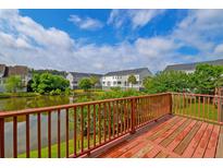 Relaxing deck view overlooking the serene lake, perfect for outdoor entertaining at 543 Mclernon Trce, Johns Island, SC 29455