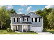 Charming two-story home featuring a symmetrical design, light blue siding and black shutters at 78 French Garden Cir, Summerville, SC 29486