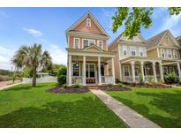 Charming two-story home with a welcoming front porch and well-manicured lawn at 101 Barberry St, Summerville, SC 29483