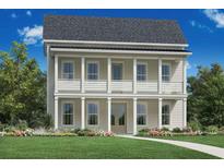 Charming two-story home boasts double balconies, columns, a manicured lawn, and beautiful landscaping at 148 Falaise St, Charleston, SC 29492