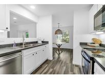 Bright eat-in kitchen featuring stainless steel appliances and updated cabinets at 202 Waterwood Dr, Goose Creek, SC 29445