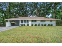 Charming single story house with manicured lawn and updated facade at 2135 Clayton St, Charleston, SC 29414