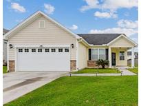 Charming single-story home boasts a well-manicured lawn and inviting curb appeal at 405 Watershed Dr Dr, Goose Creek, SC 29445