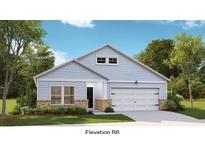 Charming single-story home with light blue siding, brick accents, and a well-manicured front lawn at 1035 Tulip St, Summerville, SC 29485