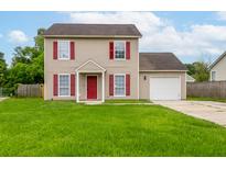 Charming two-story home with red accents, a well-manicured lawn, and an attached one-car garage at 113 Alcester Rd, Goose Creek, SC 29445